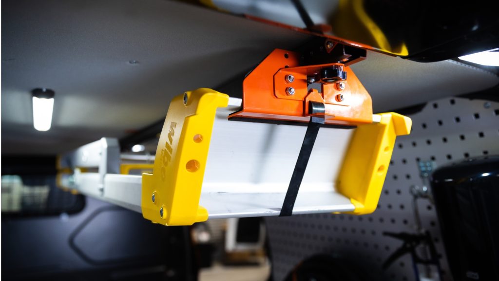 Spring-loaded ladder rack