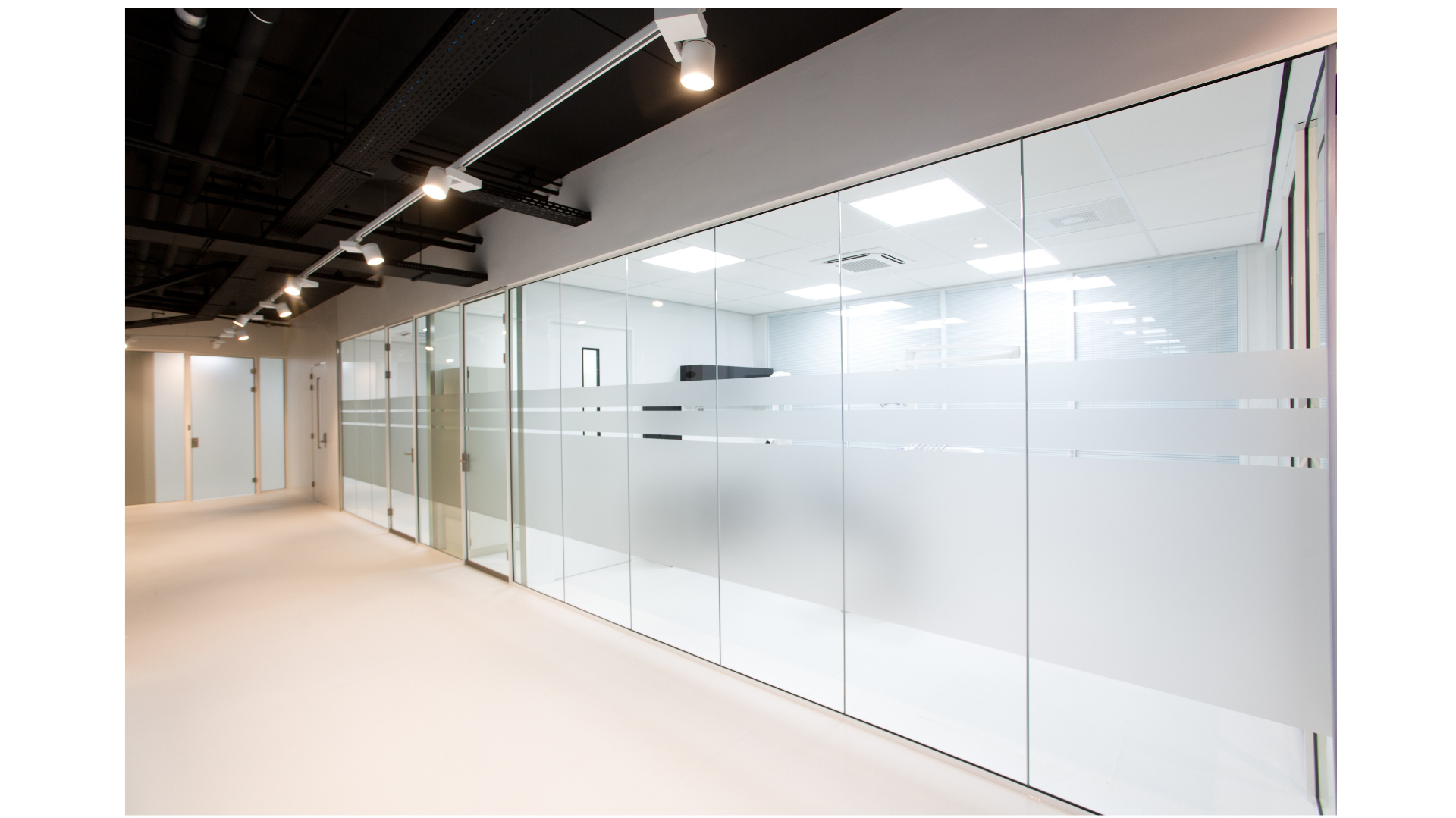 Glazed corridor walls adjacent treatment rooms