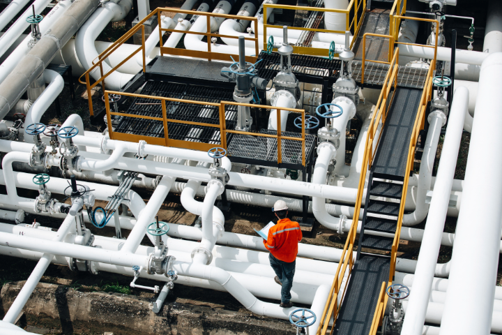 picture of a man walking on pipelines