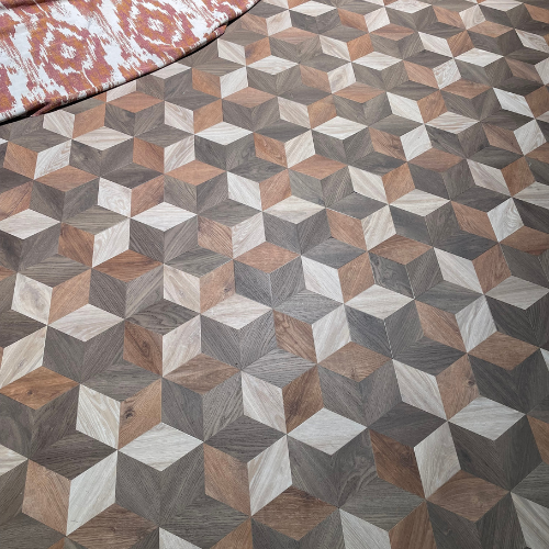 Geometrisch vloerkleed met kubuspatroon in aardetinten