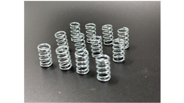 Compression spring for warm air blower