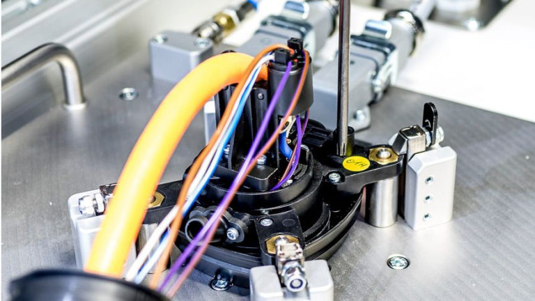 Assembly stations for High-voltage (HV) charging sockets and adapters