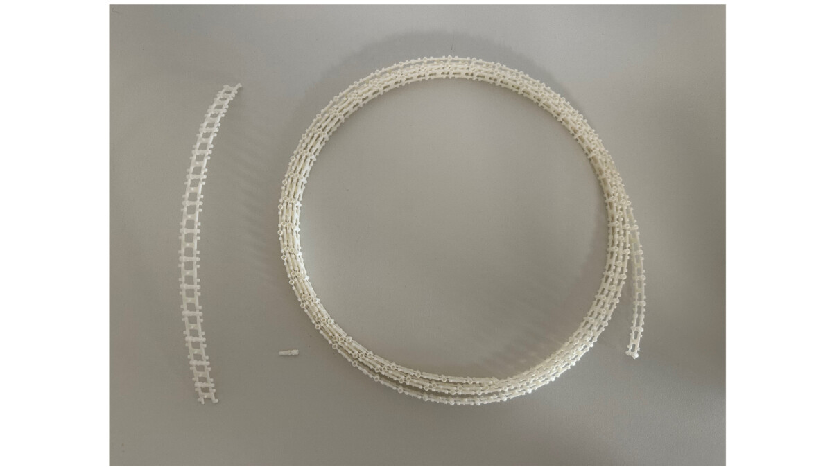 Kunststoffspritzteilband