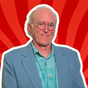 Portrait of Don Rosa in front of a red background.