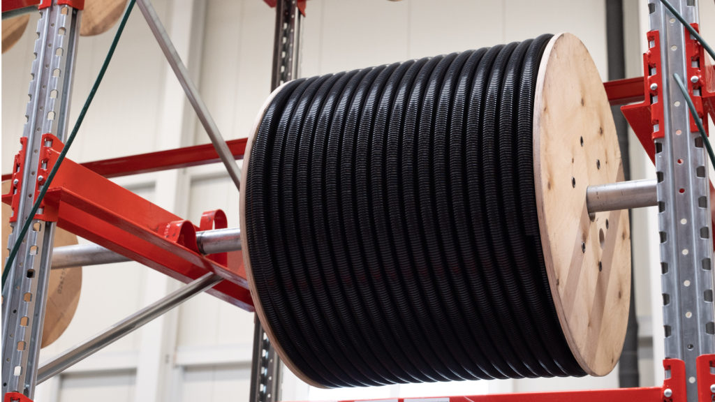 Bundled corrugated conduits on drums