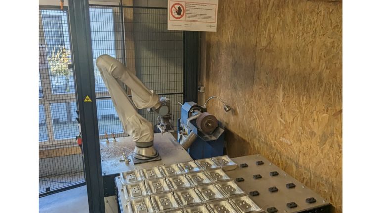 Grinding components with a cobot