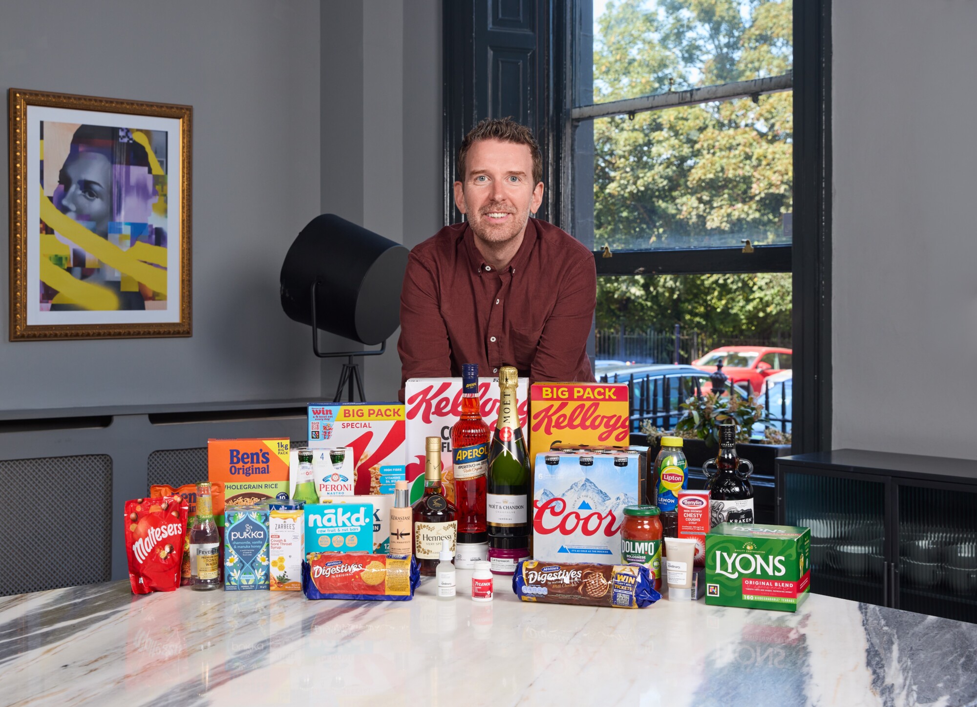 Cathal Gillen with branded products