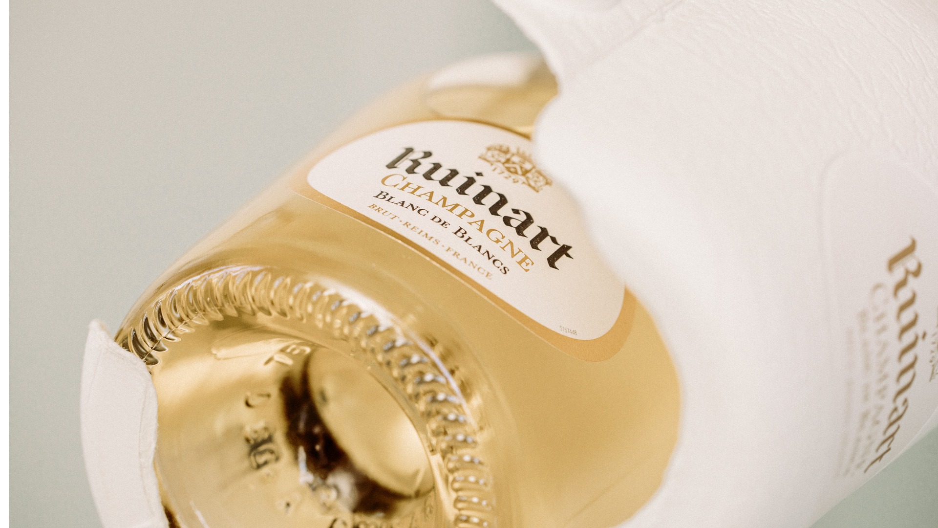 Ruinart champagne bottle in sustainable moulded fibre Second Skin packaging developed by James Cropper.