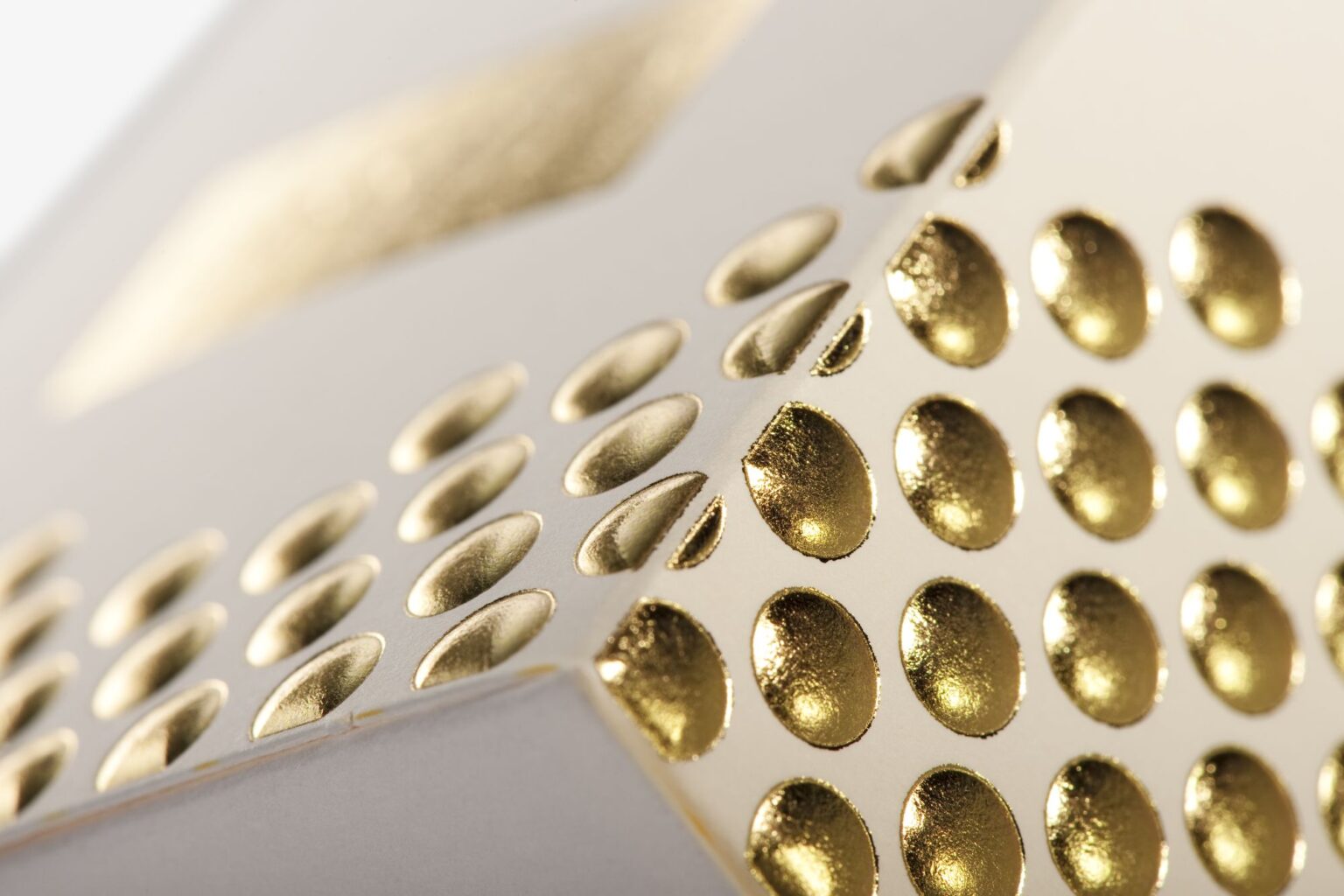 Kurz LUXOR® metallic foil finish for premium packaging, showcasing high-quality gold embellishment for luxury brands.