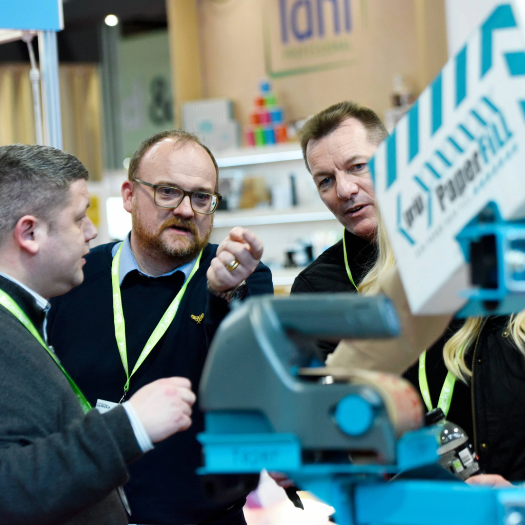 Exhibitors interacting with visitors at Empack 2024