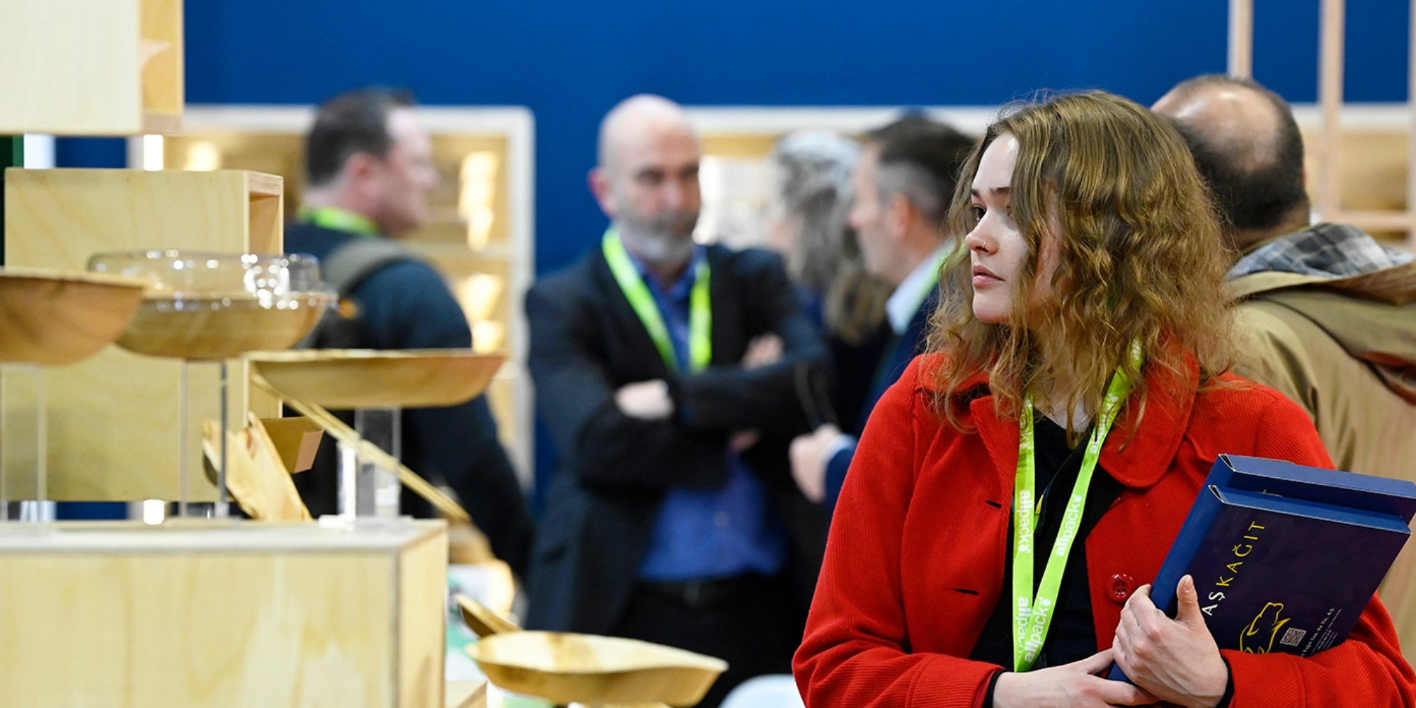 Visitor looking at packaging products displayed on an exhibitor stand at Packaging Innovations & Empack.