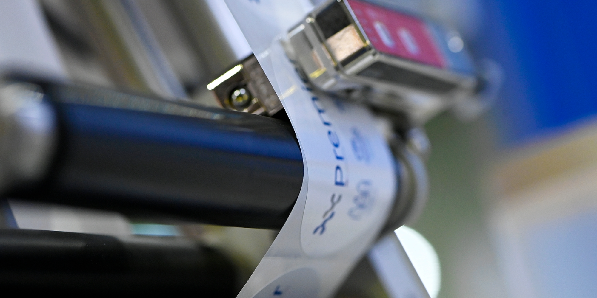 Label printing machine applying printed labels during a live demonstration at Packaging Innovations & Empack.