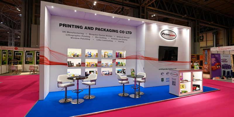 Exhibitor stand for Printing and Packaging Co Ltd displaying printed cartons and packaging designs at Packaging Innovations & Empack.