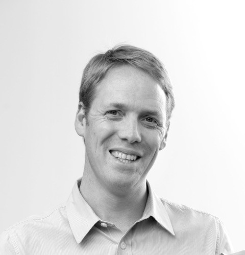 A headshot of Greg Bentley from Suntory