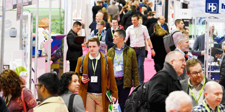 Crowds of visitors walking through the exhibition halls at Packaging Innovations & Empack.