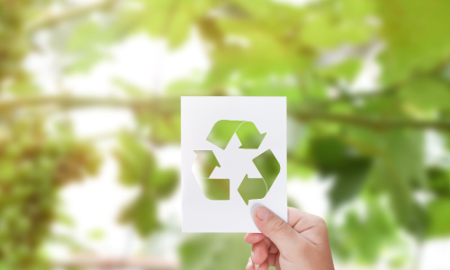 Recycling symbol representing PET recycling infrastructure and the circular economy in the UK packaging industry.