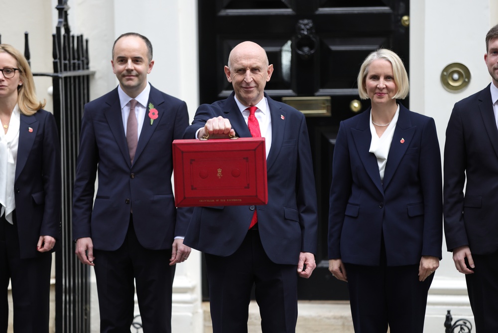 British Chancellor of the Exchequer John Healey leaves No 11 Downing Street to present his first budget to Parliament.